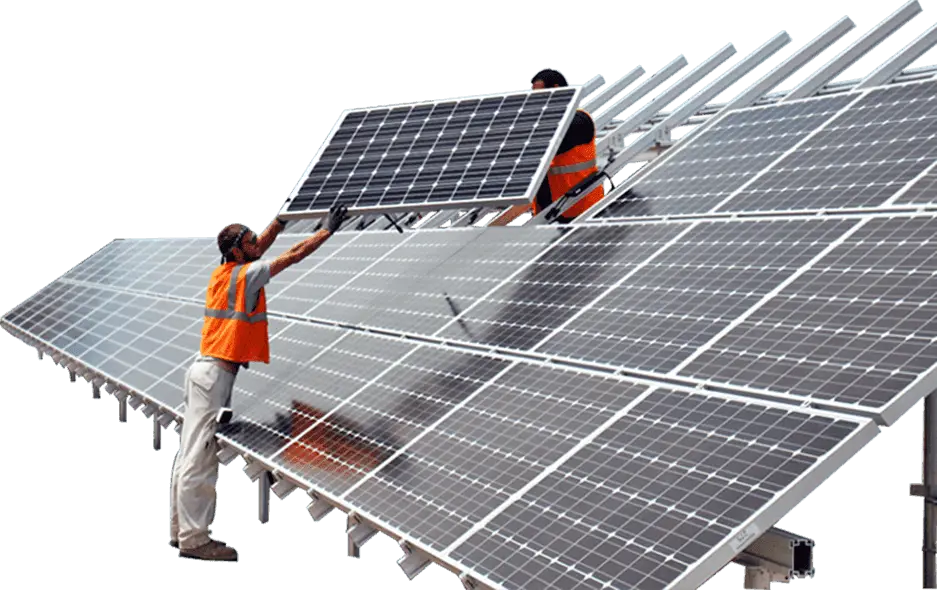 Technicians in safety vests installing solar panels on a ground-mounted solar array system.