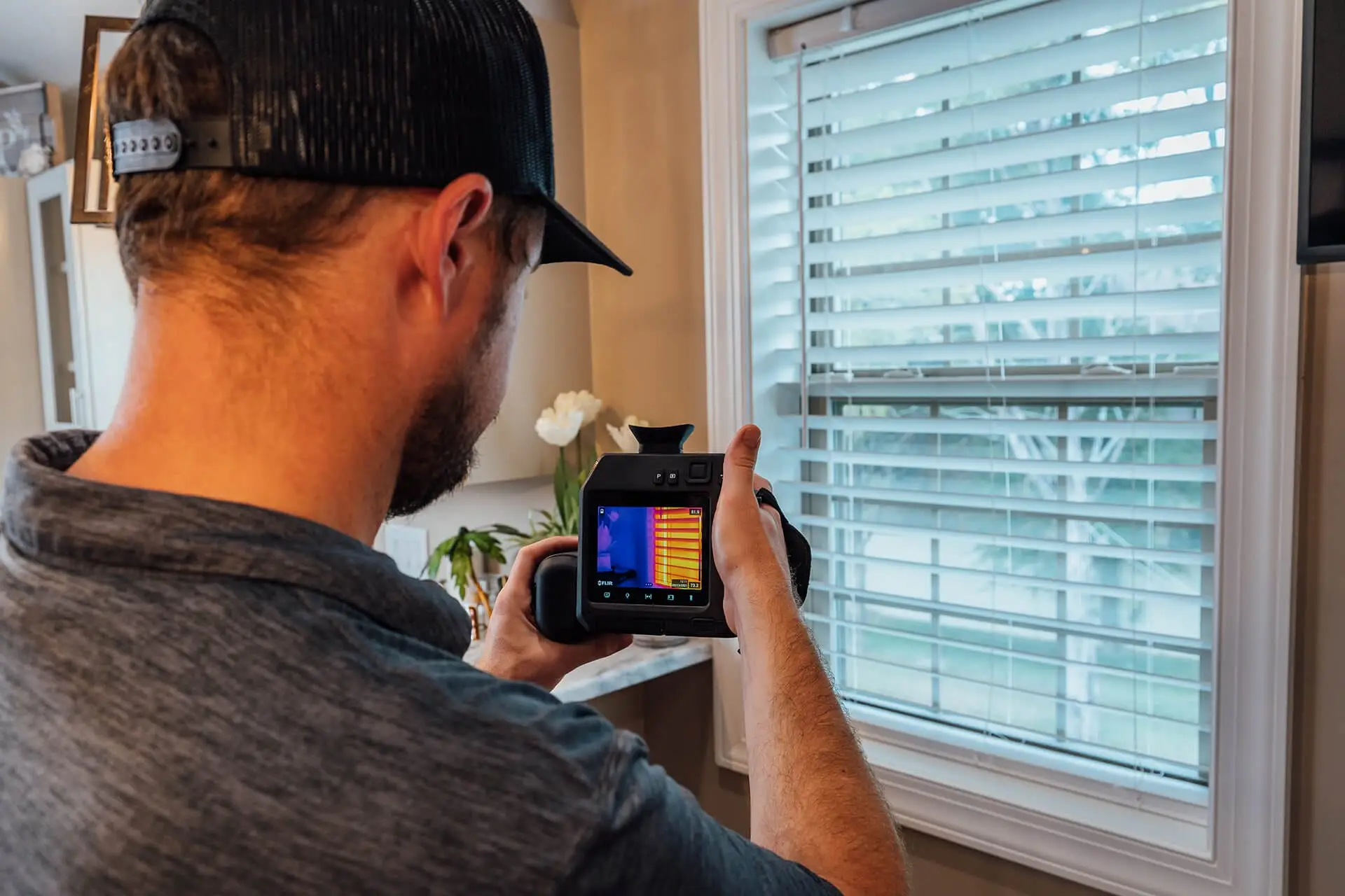 Airstream Services technician using a thermal imaging camera to perform a home inspection through thermography in Middle Tennessee.