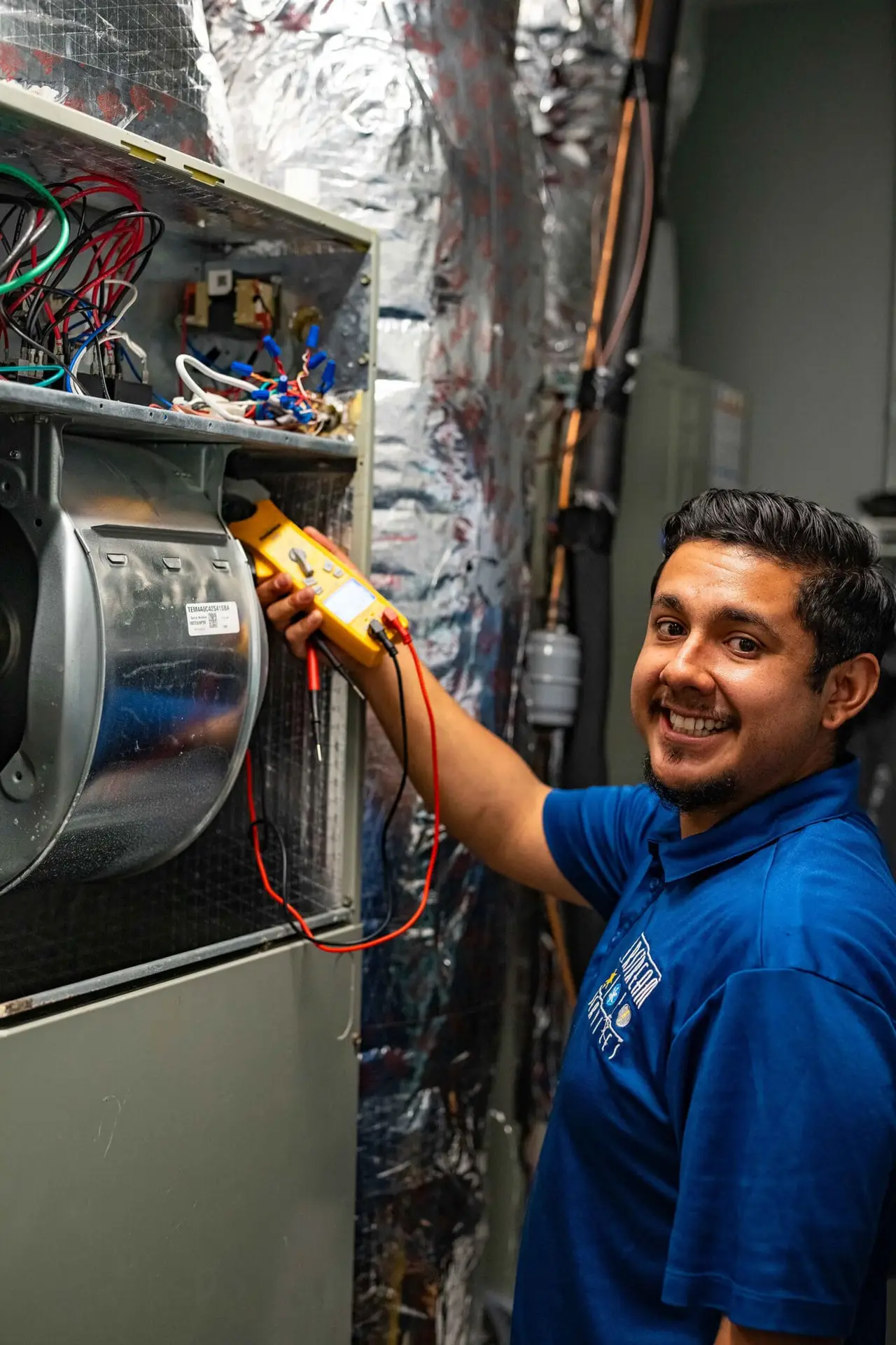 Airstream Services technician testing electrical components of a heating system during installation at a Middle Tennessee home.