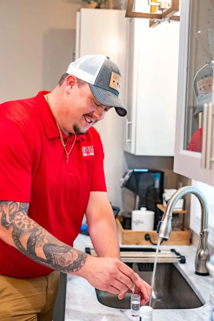 Plumber testing kitchen water for hard water levels in Murfreesboro, TN
