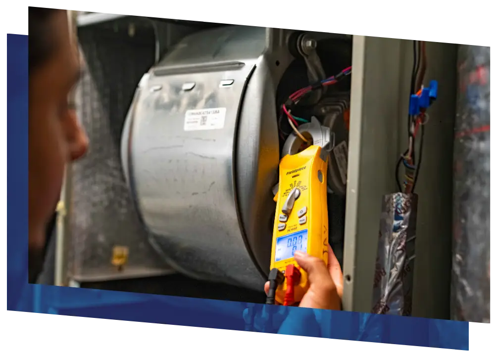 HVAC technician using a multimeter to diagnose an air handler or furnace.