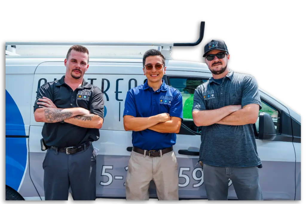 Three Airstream Plumbing, Heating & Air technicians standing with arms crossed in front of a branded service van.