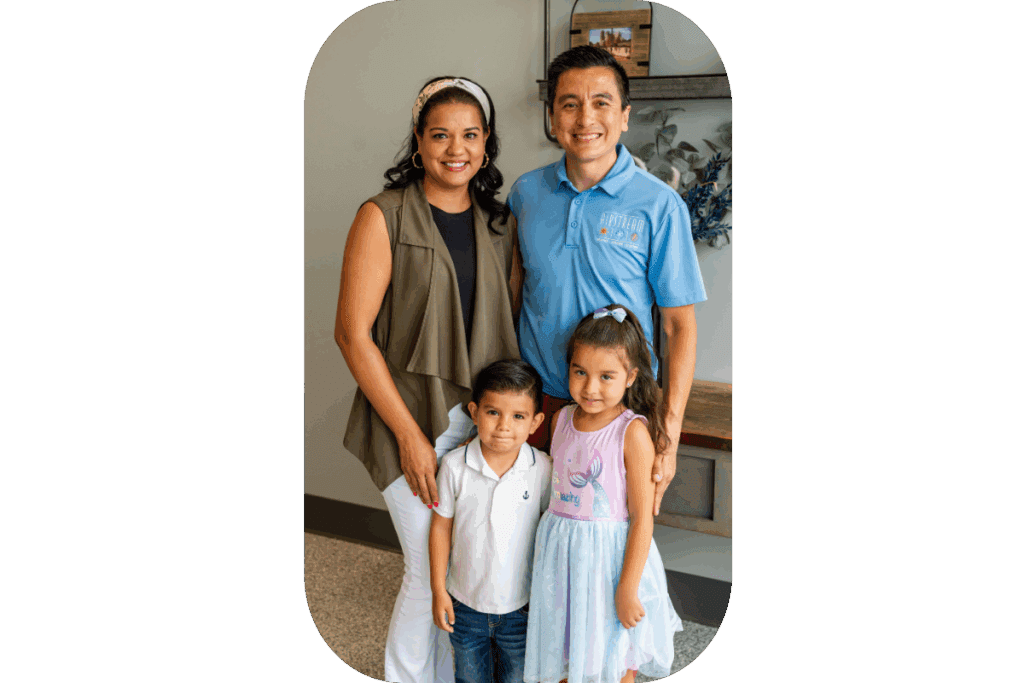 The Airstream Plumbing, Heating & Air owners with their two young children, smiling and posing together.