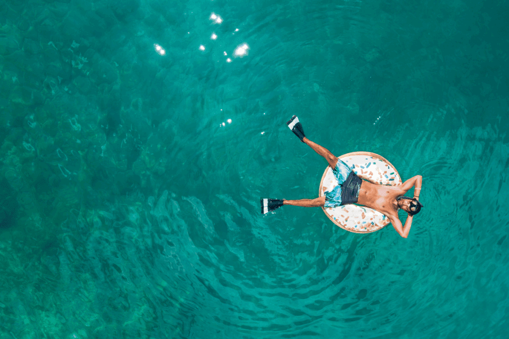 Man floating in ocean to represent PTO